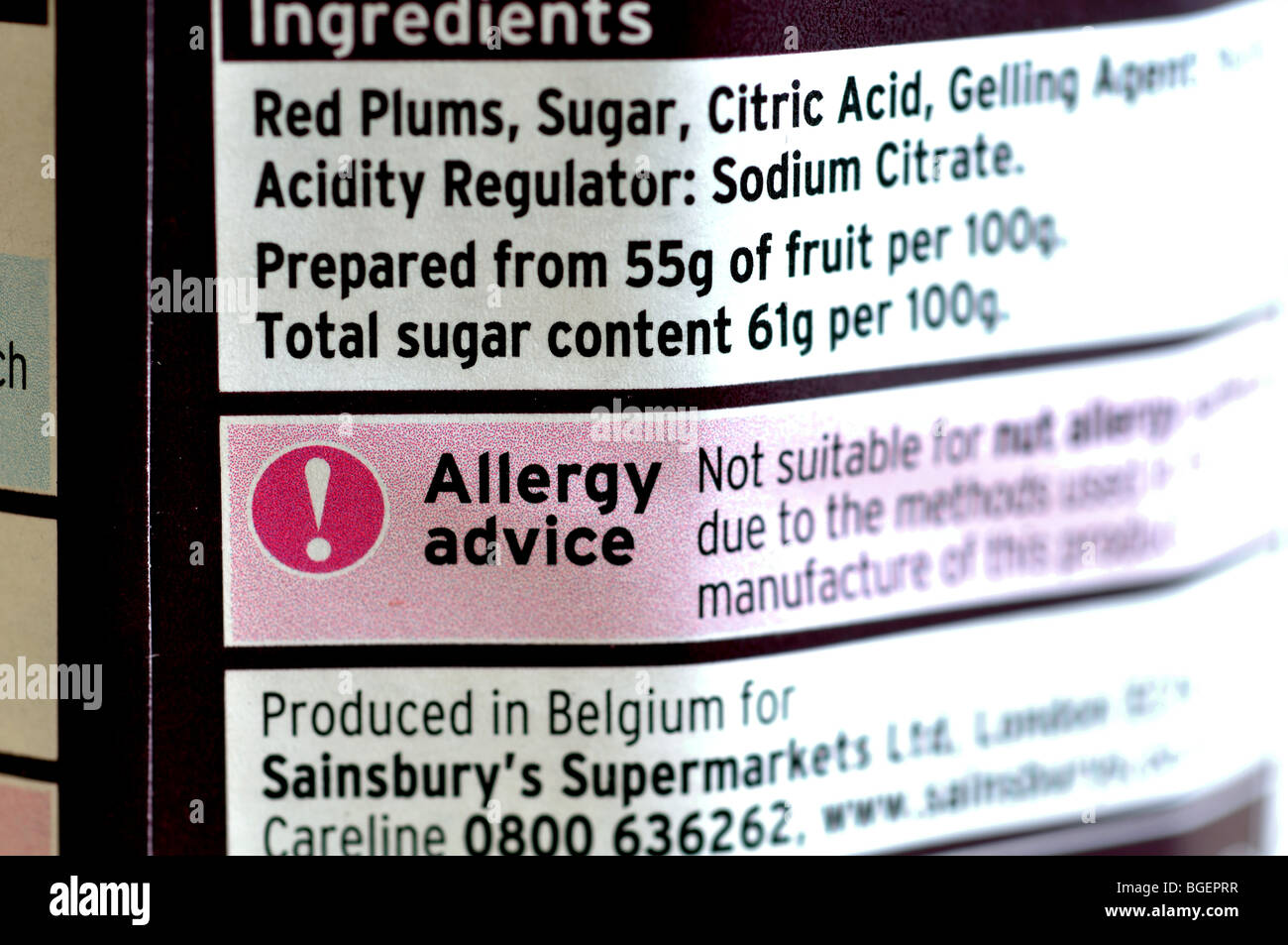 Allergy advice notice on Sainsbury`s plum jam jar Stock Photo